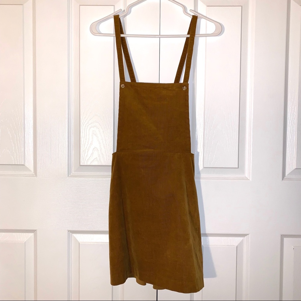 Corduroy Skirt overall with adjustable straps.